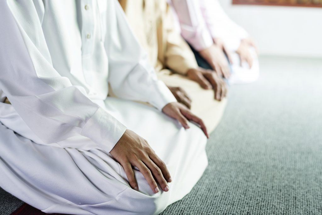 Muslim prayers in Tashahhud posture